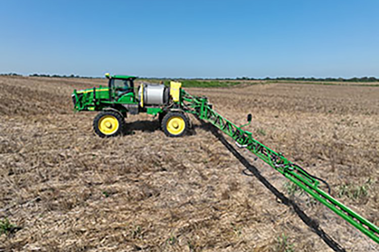 A tractor driving through a field.